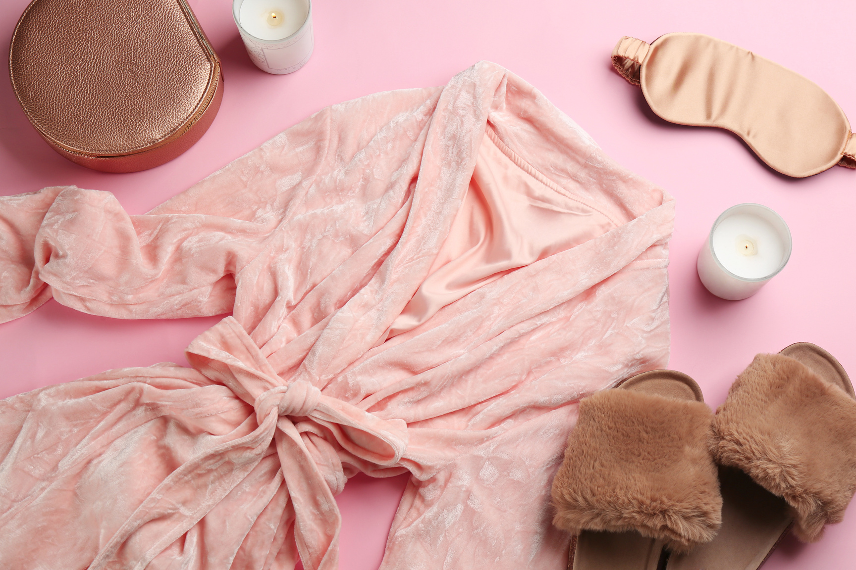 Flat Lay Composition with Fluffy Slippers and Robe on Pink Backg